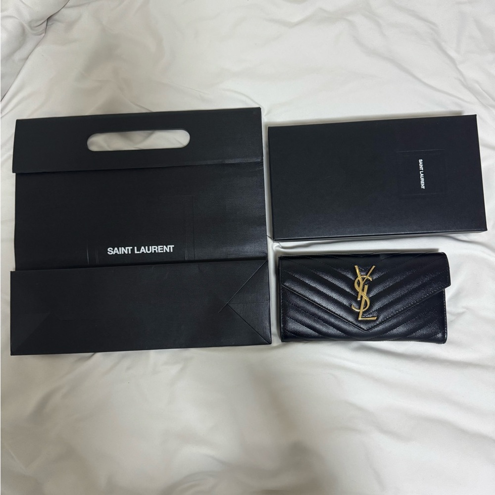 YSL CASSANDRE MATELASSÉ LARGE FLAP WALLET IN LAMBSKIN